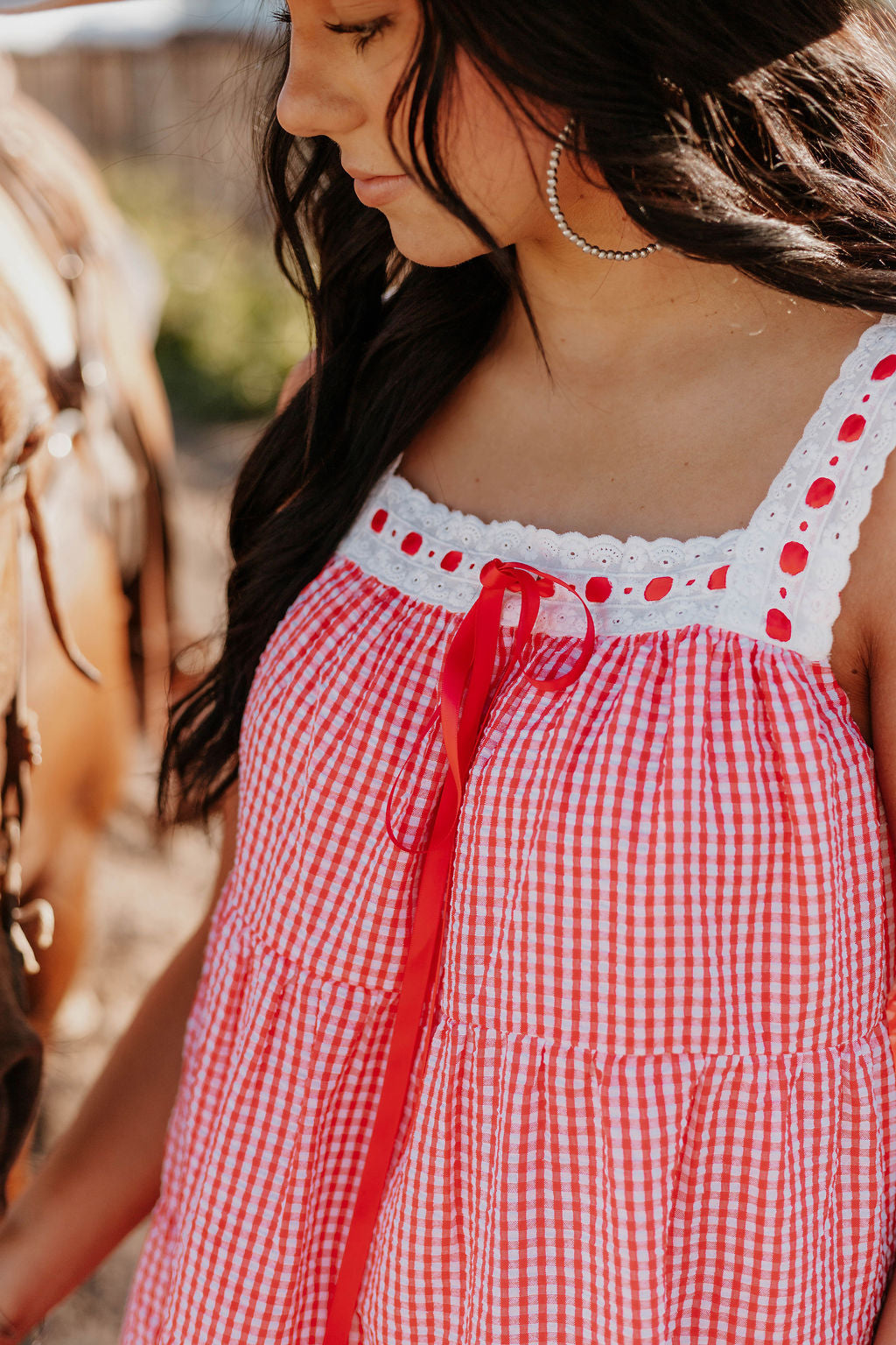 Close up of woman wearing the Woman wearing the Sweet Land of Liberty Gingham Dress