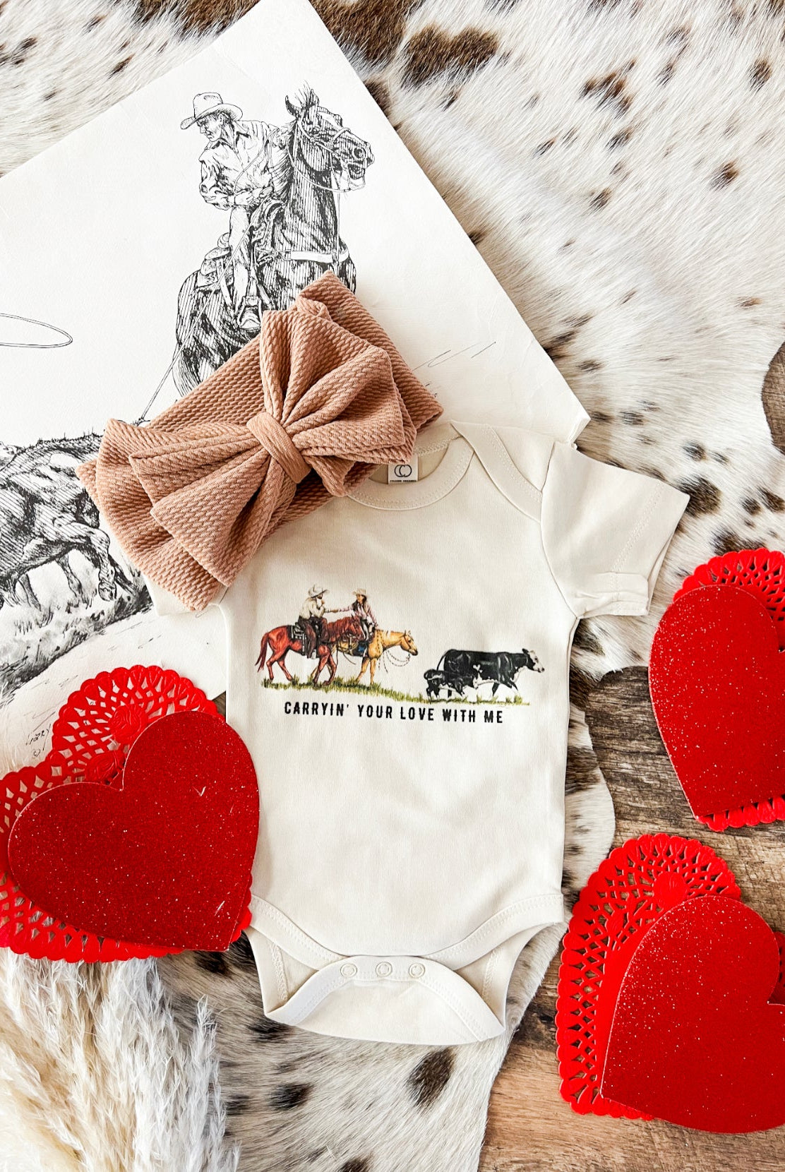 Carryin’ Your Love With Me Valentines Cowboy (Infant-S/S Onesie)(Toddler/Youth S/S Tee)(Cream)
