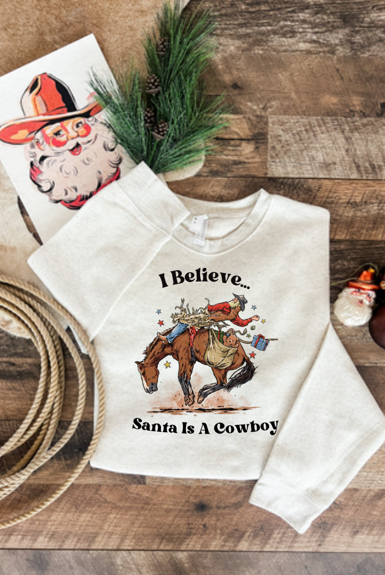 I Believe Santa Is A Cowboy Tee or Sweatshirt (heather cream) (Adult)