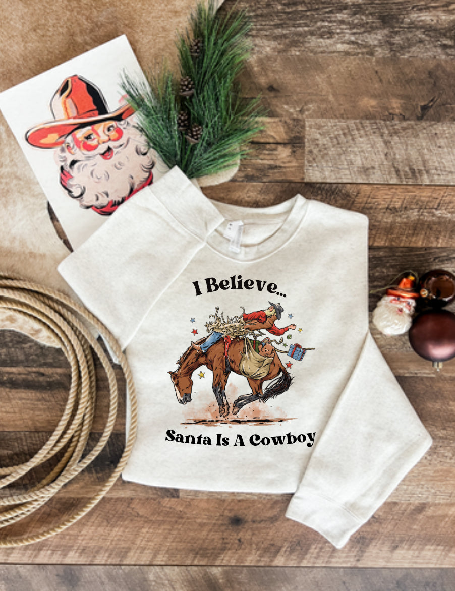 I Believe Santa Is A Cowboy Tee or Sweatshirt (heather cream) (Adult)