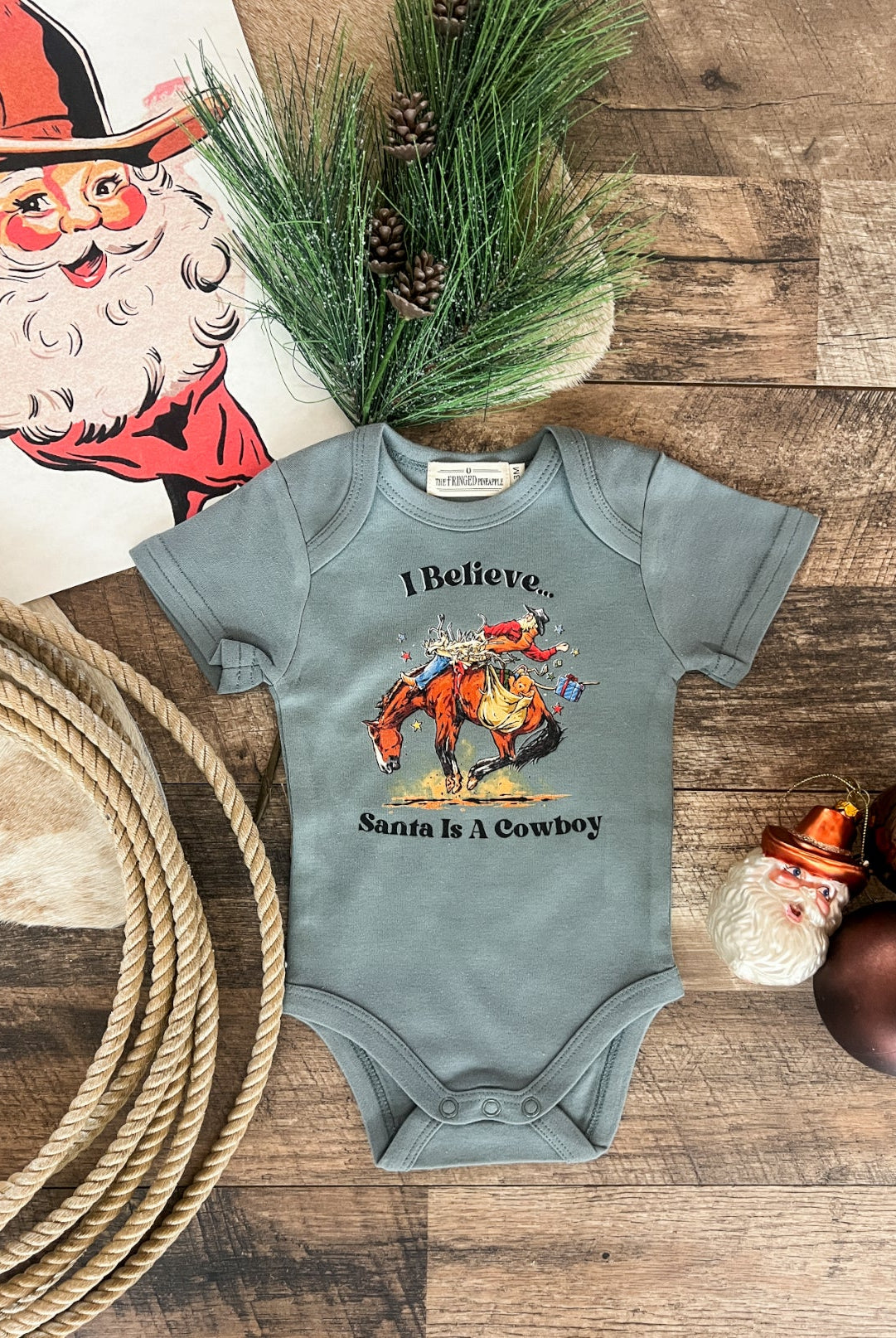 I Believe Santa Is A Cowboy Design (Onesie/Youth Tee)(Green)