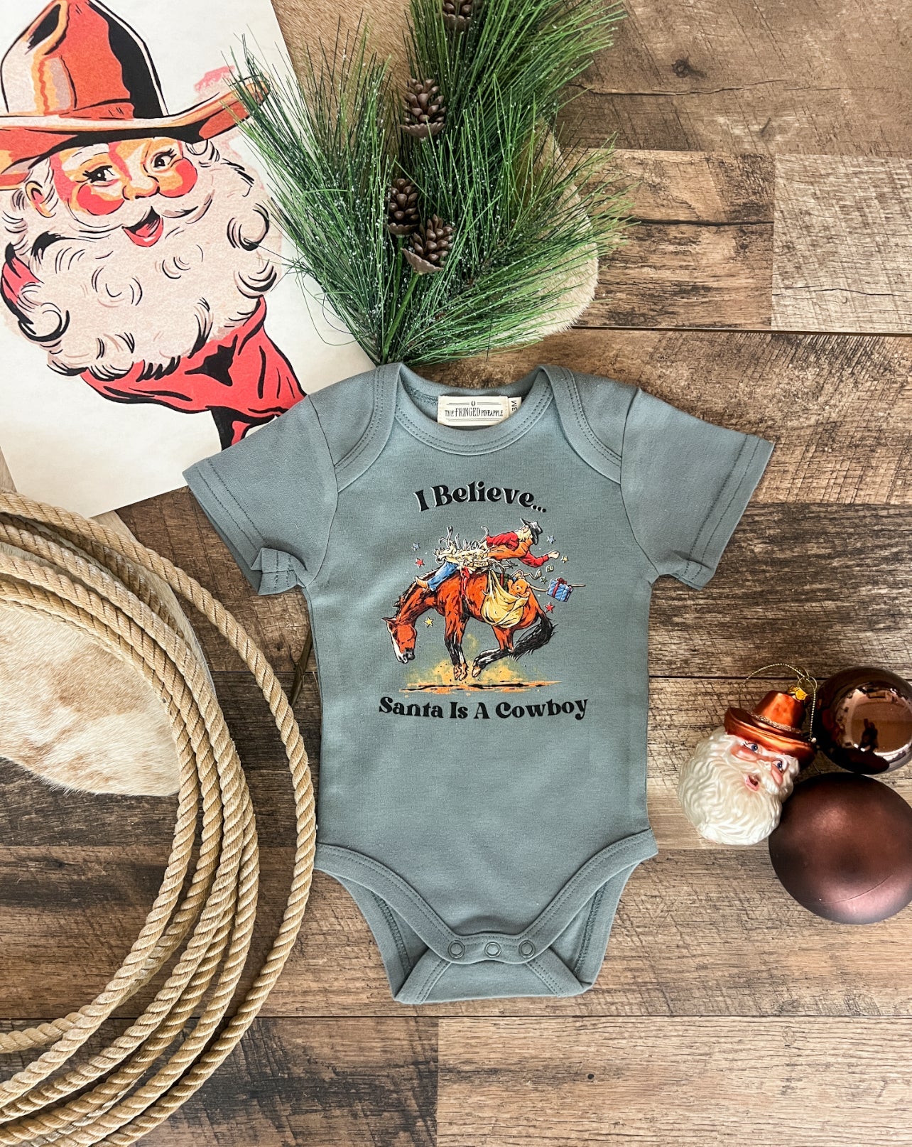 I Believe Santa Is A Cowboy Design (Onesie/Youth Tee)(Green)
