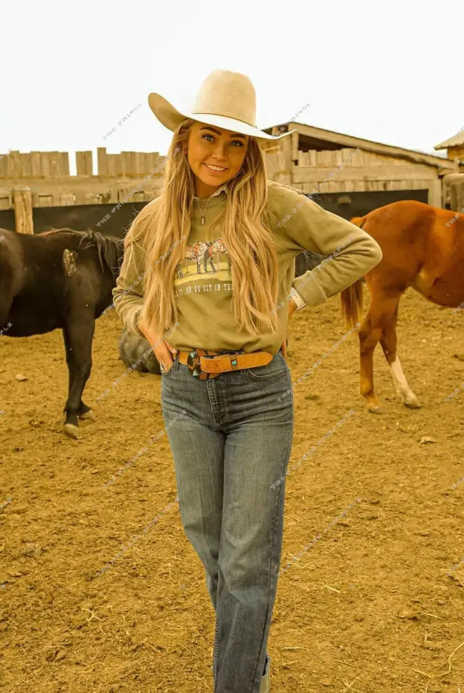 Model smiling with a Saddle Up or Go Sit In Truck Sweatshirt or Tee(green)