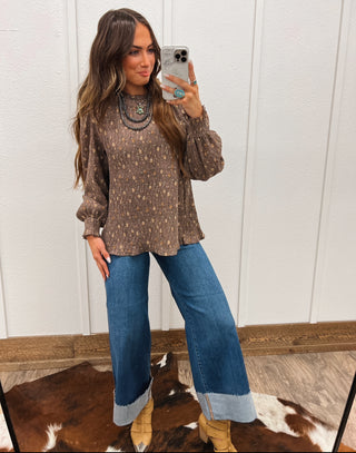 Model with a Ruffle High Neck Floral Blouse
