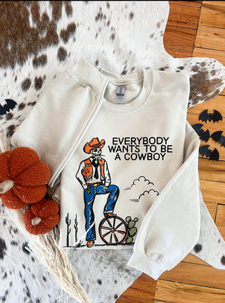 Everyone wants to be a Cowboy Halloween Graphic Design Tee or Sweatshirt (cream)