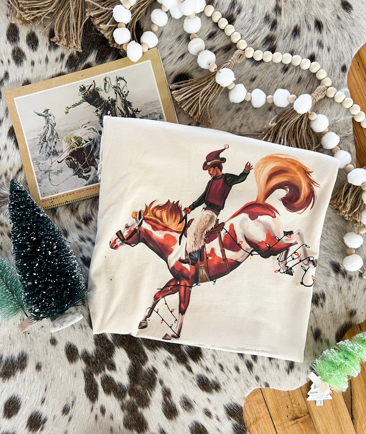 The Christmas Cowboy Light Up Christmas Design Tee or Sweatshirt (cream) (Adult)