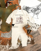 Dust Settles Cowboys Don’t (Organic One piece Long Onesie)(Cream)